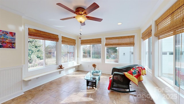 sunroom with ceiling fan