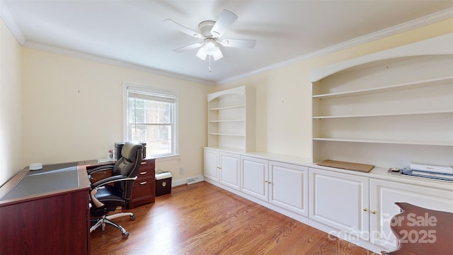 office space with crown molding, ceiling fan, light wood-type flooring, and built in shelves