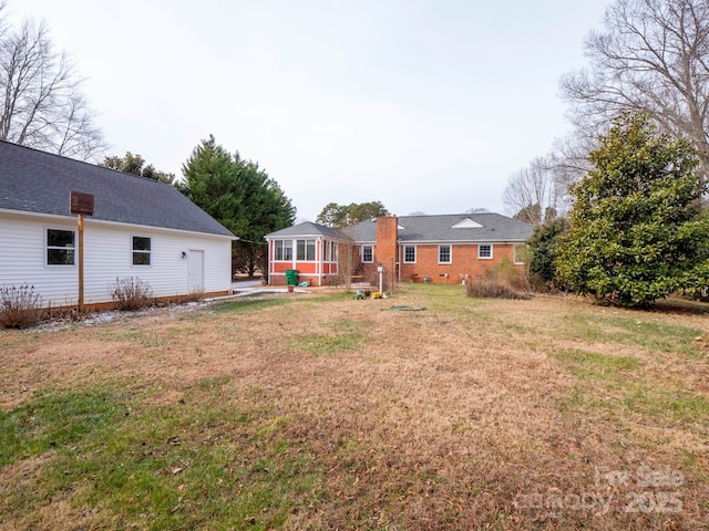 view of yard with a sunroom