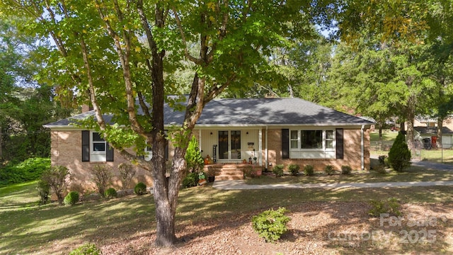 ranch-style home with a front lawn