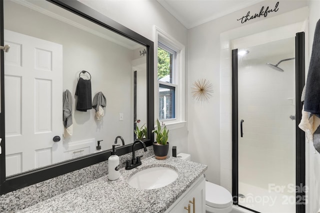 bathroom with vanity, walk in shower, crown molding, and toilet