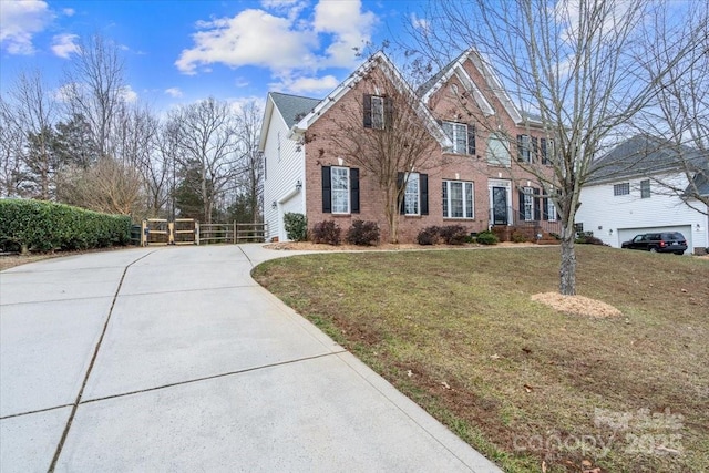 view of front of property featuring a garage and a front yard