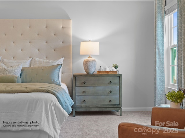 bedroom featuring light colored carpet