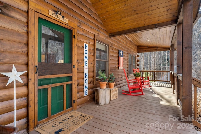 wooden terrace featuring covered porch