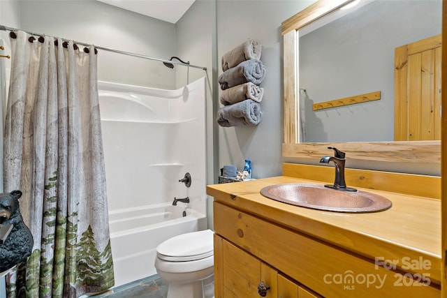 full bathroom featuring vanity, shower / tub combo, and toilet