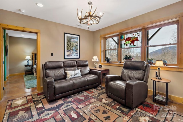 living area featuring a chandelier, recessed lighting, visible vents, and baseboards