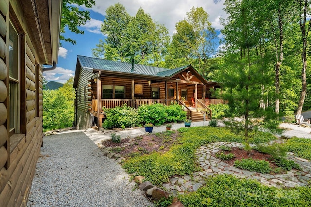 108 Oak Winds Dr Unit 202S, Old Fort, NC 28762 - log cabin featuring covered porch, log exterior, metal roof, and driveway