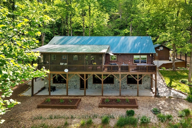 108 Oak Winds Dr Unit 202S, Old Fort, NC 28762 - rear view of property with a patio area, log exterior, stone siding, a garden, and a deck