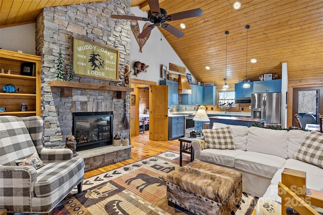 108 Oak Winds Dr Unit 202S, Old Fort, NC 28762 - living area featuring wooden ceiling, light wood-type flooring, a ceiling fan, a stone fireplace, and recessed lighting