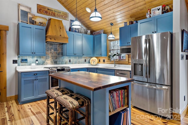108 Oak Winds Dr Unit 202S, Old Fort, NC 28762 - kitchen with appliances with stainless steel finishes, butcher block countertops, blue cabinets, a sink, and lofted ceiling