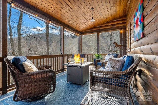 108 Oak Winds Dr Unit 202S, Old Fort, NC 28762 - sunroom / solarium with lofted ceiling and an outdoor living space with a fire pit