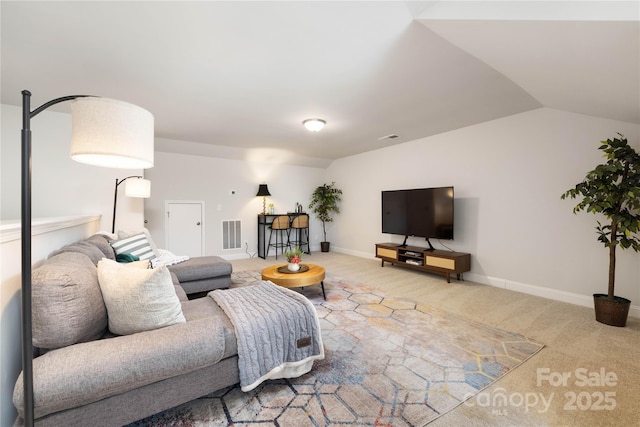 living room with lofted ceiling and carpet