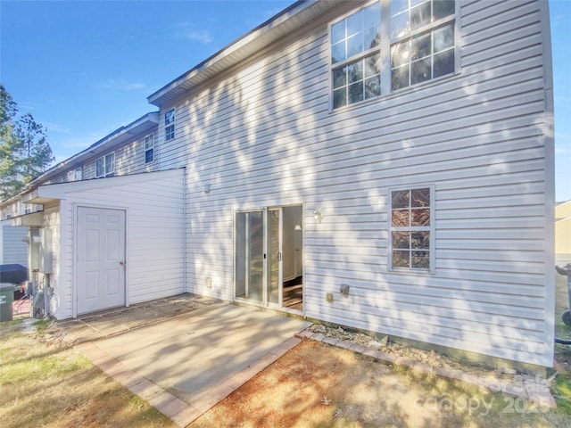 back of property featuring a patio