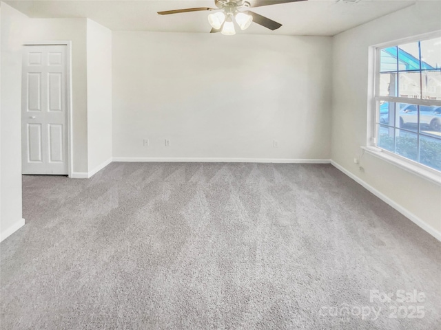 spare room with carpet flooring and ceiling fan