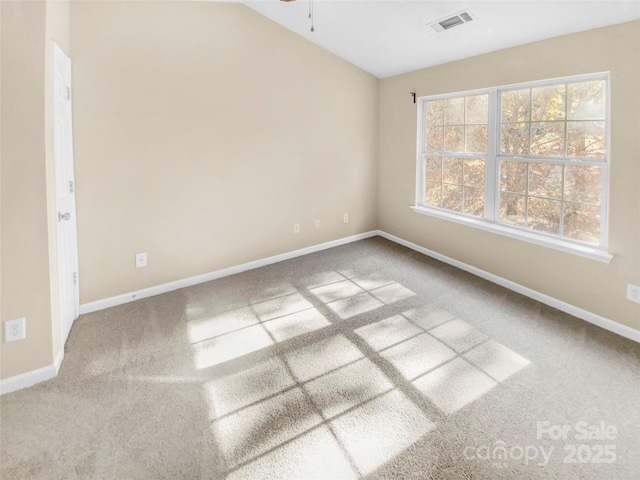 empty room with ceiling fan and carpet flooring