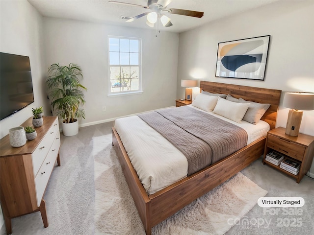 bedroom featuring light carpet and ceiling fan