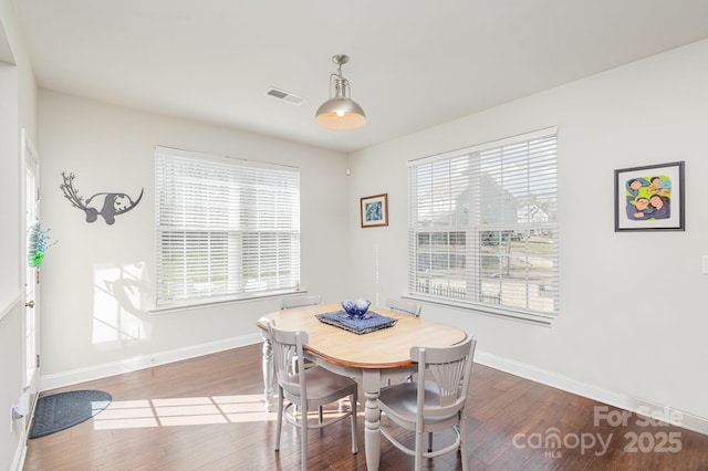 dining room with hardwood / wood-style flooring