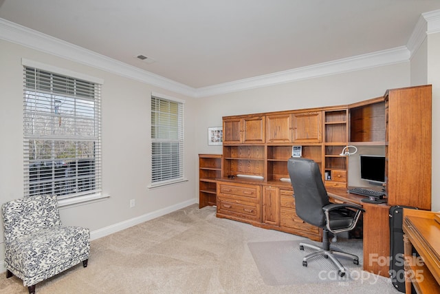 carpeted home office featuring crown molding