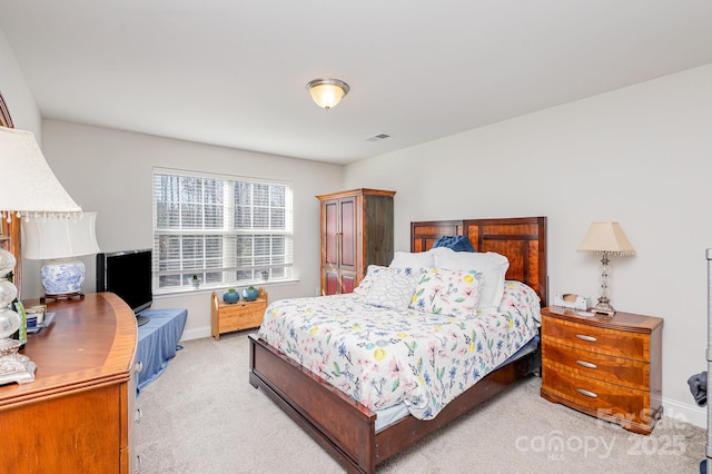 bedroom featuring light carpet