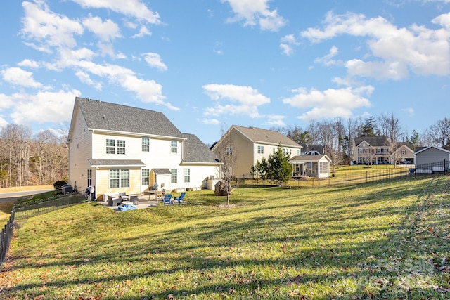 rear view of property with a patio area and a lawn