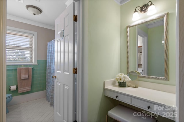 bathroom featuring tile walls, tile patterned flooring, vanity, ornamental molding, and toilet