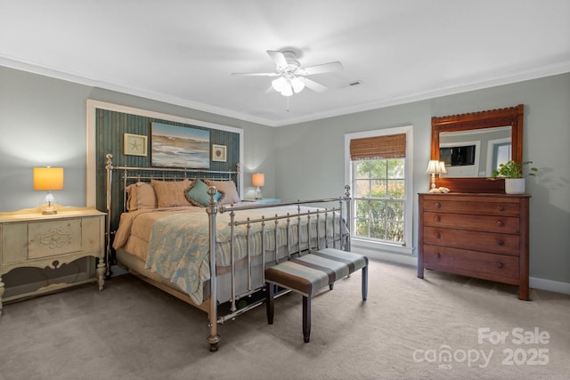 bedroom featuring crown molding, ceiling fan, and carpet