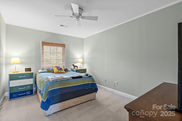 carpeted bedroom with ornamental molding and ceiling fan