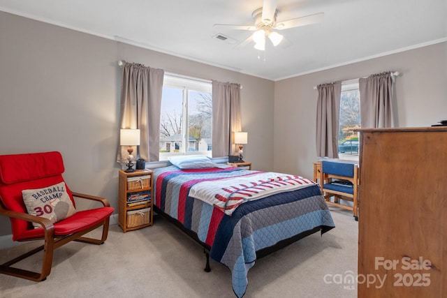 carpeted bedroom featuring multiple windows, ornamental molding, and ceiling fan