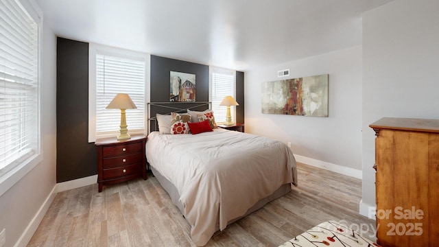 bedroom featuring light wood-type flooring