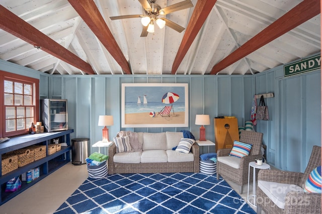 living room featuring ceiling fan and lofted ceiling with beams