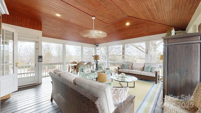 sunroom with ceiling fan, lofted ceiling, and wood ceiling