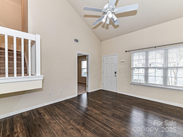 unfurnished room featuring a wealth of natural light, high vaulted ceiling, dark hardwood / wood-style floors, and ceiling fan