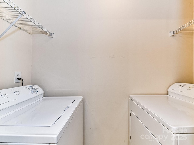 clothes washing area featuring washing machine and dryer