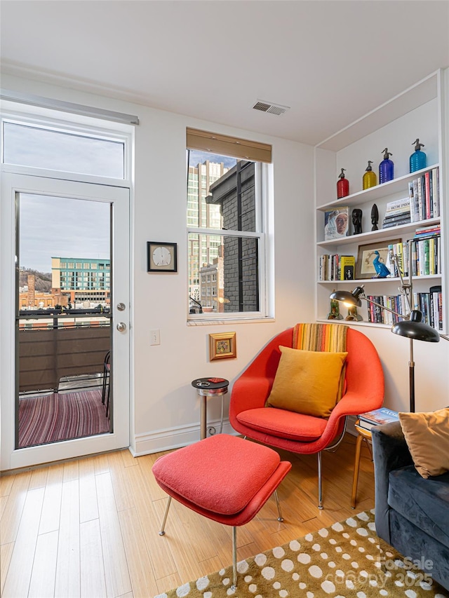 sitting room featuring hardwood / wood-style floors