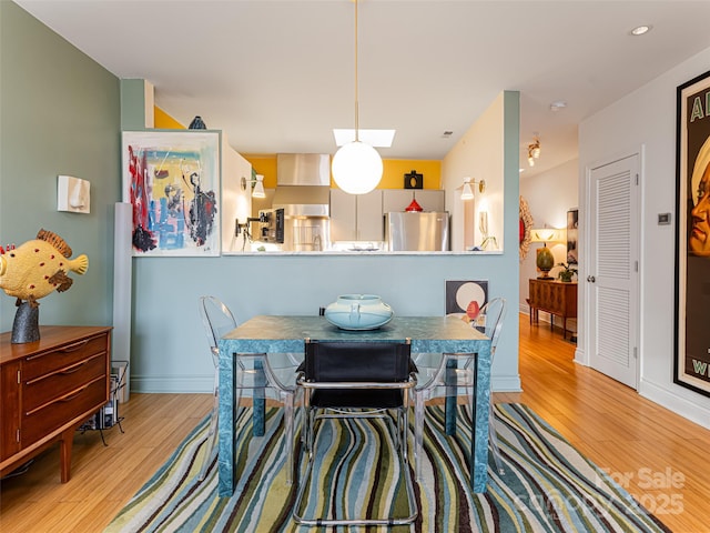 dining room featuring light wood-type flooring