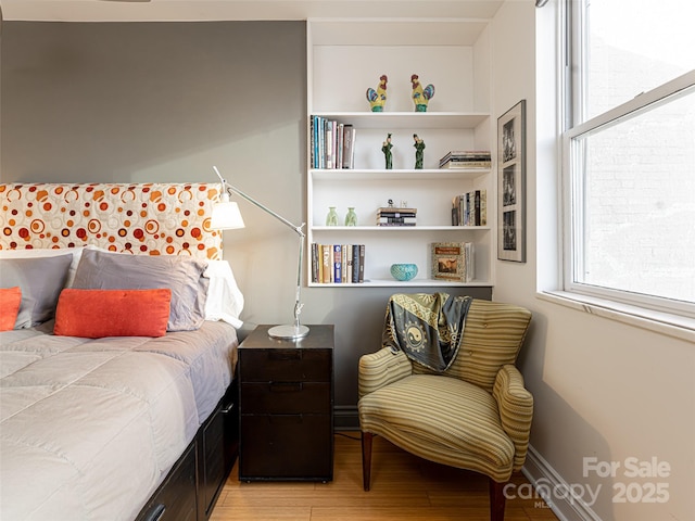 bedroom with light hardwood / wood-style floors