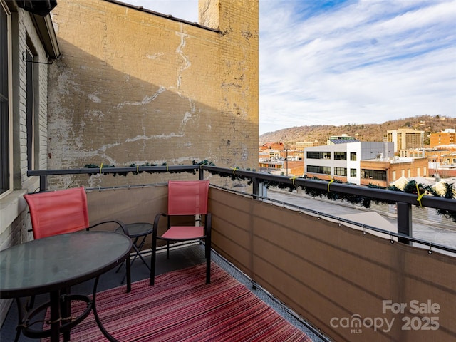 balcony featuring a mountain view