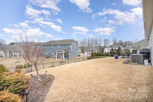 view of yard with central AC