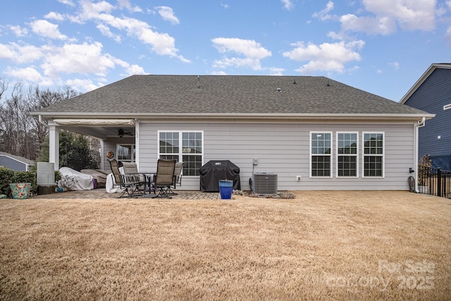 rear view of house featuring central AC, a patio, ceiling fan, and a lawn