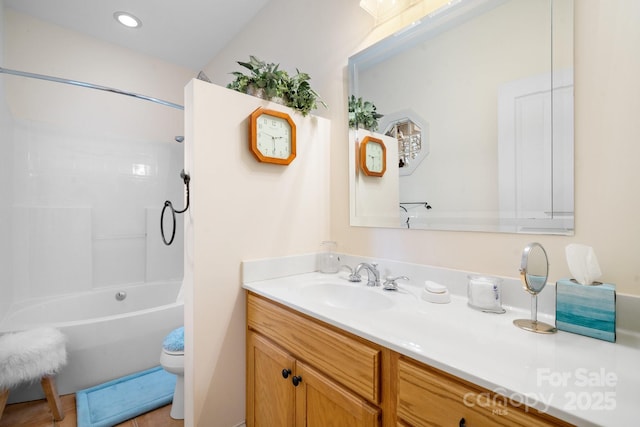 full bathroom featuring vanity, tub / shower combination, and toilet