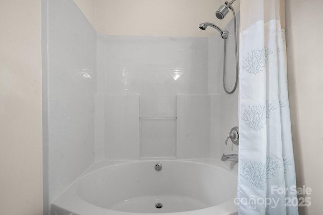 bathroom featuring shower / tub combo with curtain