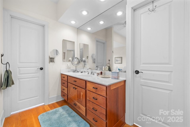 bathroom with wood-type flooring and vanity