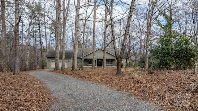 ranch-style home featuring a garage