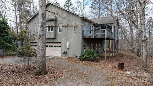 exterior space with a garage and a deck