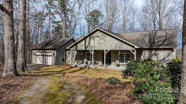 view of front of house with a garage and covered porch