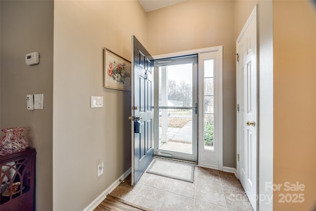 entryway featuring light tile patterned floors