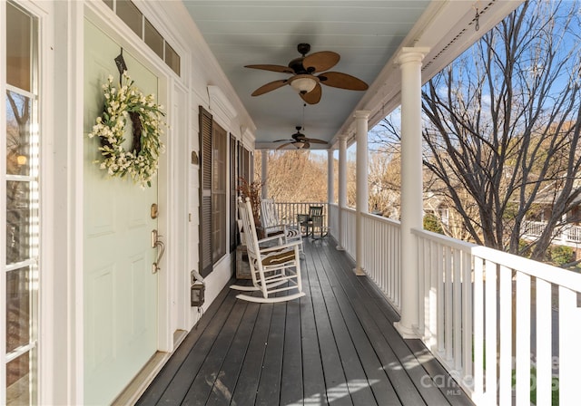 wooden deck with covered porch and ceiling fan