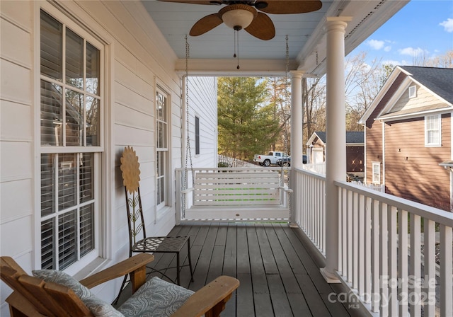 wooden deck featuring ceiling fan and a porch