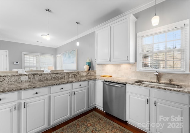 kitchen with white cabinetry, a sink, decorative light fixtures, and stainless steel dishwasher