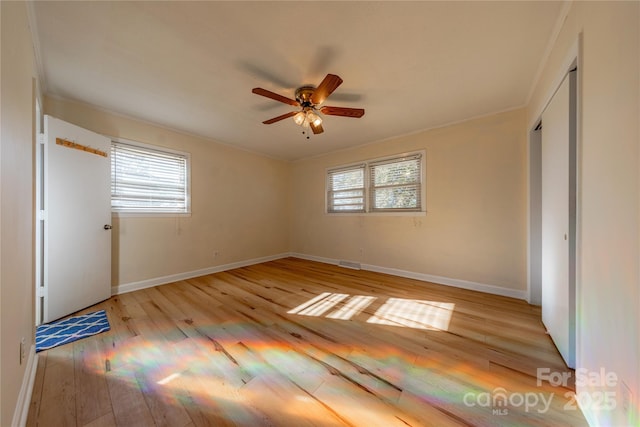 unfurnished bedroom featuring ceiling fan and light hardwood / wood-style flooring